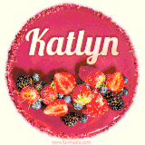 Beautifully decorated red velvet berry birthday cake with vibrant fruits and a glowing 'Katlyn' name, adding a touch of sweetness and sparkle.