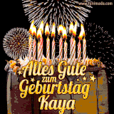 A chocolate birthday cake with glowing candles, the German text 'Alles Gute zum Geburtstag Kaya,' and vibrant fireworks lighting up the background in an animated GIF.