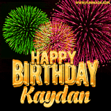 A captivating GIF with bursts of green, pink, and orange fireworks lighting up the night sky, accompanied by 'Happy Birthday Kaydan' in glowing golden text.