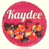 Beautifully decorated red velvet berry birthday cake with vibrant fruits and a glowing 'Kaydee' name, adding a touch of sweetness and sparkle.