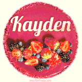 Beautifully decorated red velvet berry birthday cake with vibrant fruits and a glowing 'Kayden' name, adding a touch of sweetness and sparkle.
