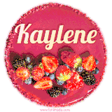 Beautifully decorated red velvet berry birthday cake with vibrant fruits and a glowing 'Kaylene' name, adding a touch of sweetness and sparkle.