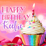 A vibrant birthday GIF featuring a rainbow-colored cupcake topped with white frosting, sprinkles, and a lit candle. The text reads 'Happy Birthday Keelie' in bold pink and violet letters with white outline.