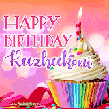 A vibrant birthday GIF featuring a rainbow-colored cupcake topped with white frosting, sprinkles, and a lit candle. The text reads 'Happy Birthday Keezheekoni' in bold pink and violet letters with white outline.