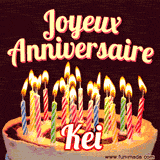 A Happy Birthday GIF in French featuring a festive birthday cake adorned with bright candles and the glowing text 'Joyeux Anniversaire Kei' in a cheerful style.