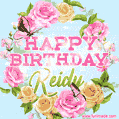 A charming animated GIF featuring 'Happy Birthday Keidy' in pink and green text, surrounded by delicate roses, leaves, and fluttering butterflies on a soft light blue pastel background.