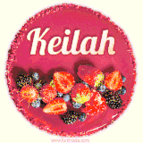 Beautifully decorated red velvet berry birthday cake with vibrant fruits and a glowing 'Keilah' name, adding a touch of sweetness and sparkle.