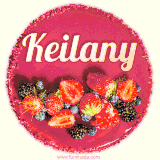 Beautifully decorated red velvet berry birthday cake with vibrant fruits and a glowing 'Keilany' name, adding a touch of sweetness and sparkle.