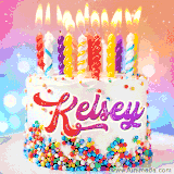 A cheerful white birthday cake with multicolor sprinkles, lit candles, and 'Kelsey' written in vibrant letters, in an animated GIF.