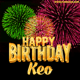 A captivating GIF with bursts of green, pink, and orange fireworks lighting up the night sky, accompanied by 'Happy Birthday Keo' in glowing golden text.