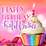 A vibrant birthday GIF featuring a rainbow-colored cupcake topped with white frosting, sprinkles, and a lit candle. The text reads 'Happy Birthday Ketilfríður' in bold pink and violet letters with white outline.