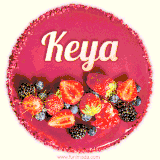 Beautifully decorated red velvet berry birthday cake with vibrant fruits and a glowing 'Keya' name, adding a touch of sweetness and sparkle.