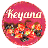 Beautifully decorated red velvet berry birthday cake with vibrant fruits and a glowing 'Keyana' name, adding a touch of sweetness and sparkle.