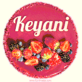 Beautifully decorated red velvet berry birthday cake with vibrant fruits and a glowing 'Keyani' name, adding a touch of sweetness and sparkle.