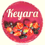 Beautifully decorated red velvet berry birthday cake with vibrant fruits and a glowing 'Keyara' name, adding a touch of sweetness and sparkle.