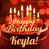 Beautifully decorated red velvet berry birthday cake with vibrant fruits and a glowing 'Keyla' name, adding a touch of sweetness and sparkle.