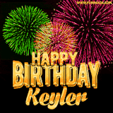 A captivating GIF with bursts of green, pink, and orange fireworks lighting up the night sky, accompanied by 'Happy Birthday Keyler' in glowing golden text.