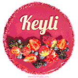 Beautifully decorated red velvet berry birthday cake with vibrant fruits and a glowing 'Keyli' name, adding a touch of sweetness and sparkle.