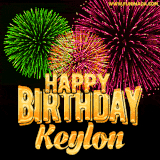 A captivating GIF with bursts of green, pink, and orange fireworks lighting up the night sky, accompanied by 'Happy Birthday Keylon' in glowing golden text.