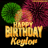 A captivating GIF with bursts of green, pink, and orange fireworks lighting up the night sky, accompanied by 'Happy Birthday Keylor' in glowing golden text.
