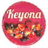 Beautifully decorated red velvet berry birthday cake with vibrant fruits and a glowing 'Keyona' name, adding a touch of sweetness and sparkle.