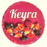 Beautifully decorated red velvet berry birthday cake with vibrant fruits and a glowing 'Keyra' name, adding a touch of sweetness and sparkle.