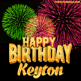 A captivating GIF with bursts of green, pink, and orange fireworks lighting up the night sky, accompanied by 'Happy Birthday Keyton' in glowing golden text.