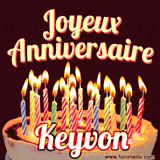 A Happy Birthday GIF in French featuring a festive birthday cake adorned with bright candles and the glowing text 'Joyeux Anniversaire Keyvon' in a cheerful style.