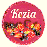 Beautifully decorated red velvet berry birthday cake with vibrant fruits and a glowing 'Kezia' name, adding a touch of sweetness and sparkle.