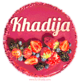 Beautifully decorated red velvet berry birthday cake with vibrant fruits and a glowing 'Khadija' name, adding a touch of sweetness and sparkle.
