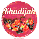 Beautifully decorated red velvet berry birthday cake with vibrant fruits and a glowing 'Khadijah' name, adding a touch of sweetness and sparkle.
