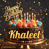 A chocolate drip birthday cake on a stand with colorful frosting and lit candles, featuring the name Khaleel in glowing yellow letters.