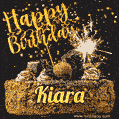 Celebrate Kiara's birthday with a GIF featuring chocolate cake, a lit sparkler, and golden stars