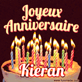 A Happy Birthday GIF in French featuring a festive birthday cake adorned with bright candles and the glowing text 'Joyeux Anniversaire Kieran' in a cheerful style.