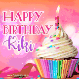 A vibrant birthday GIF featuring a rainbow-colored cupcake topped with white frosting, sprinkles, and a lit candle. The text reads 'Happy Birthday Kiki' in bold pink and violet letters with white outline.