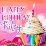 A vibrant birthday GIF featuring a rainbow-colored cupcake topped with white frosting, sprinkles, and a lit candle. The text reads 'Happy Birthday Kiley' in bold pink and violet letters with white outline.