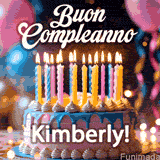 Birthday cake topped with pink and yellow lit candles, surrounded by glowing bokeh lights and party balloons. The greeting 'Buon Compleanno Kimberly GIF!' is displayed.