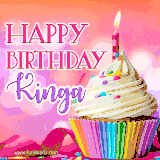 A vibrant birthday GIF featuring a rainbow-colored cupcake topped with white frosting, sprinkles, and a lit candle. The text reads 'Happy Birthday Kinga' in bold pink and violet letters with white outline.