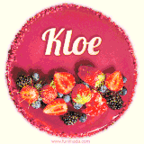 Beautifully decorated red velvet berry birthday cake with vibrant fruits and a glowing 'Kloe' name, adding a touch of sweetness and sparkle.