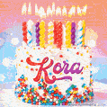 Personalized for Kora elegant birthday cake adorned with rainbow sprinkles, colorful candles and glitter
