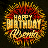 Golden 'Happy Birthday Ksenia' text accompanied by animated rainbow fireworks for a festive animated greeting.
