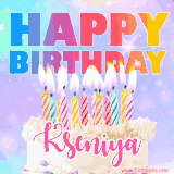 A vibrant animated name GIF with the words 'Happy Birthday Kseniya' with colorful candles on a creamy cake. The background sparkles with pastel shades, adding a festive touch.
