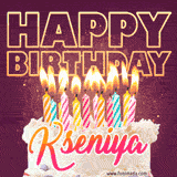 A colorful birthday cake topped with lit candles, with the words 'Happy Birthday Kseniya' in bold glowing letters on a burgundy background. Animated flames add a festive touch.