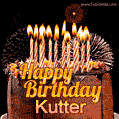 A rich chocolate cake topped with glowing birthday candles and surrounded by bright fireworks. The animated GIF displays the message 'Happy Birthday Kutter' in golden text.