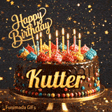 Close-up of a decorative chocolate cake with a gold Happy Birthday topper and warm glowing candle flames, made for Kutter.