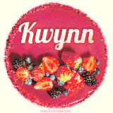 Beautifully decorated red velvet berry birthday cake with vibrant fruits and a glowing 'Kwynn' name, adding a touch of sweetness and sparkle.