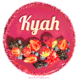 Beautifully decorated red velvet berry birthday cake with vibrant fruits and a glowing 'Kyah' name, adding a touch of sweetness and sparkle.