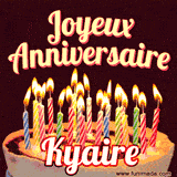 A Happy Birthday GIF in French featuring a festive birthday cake adorned with bright candles and the glowing text 'Joyeux Anniversaire Kyaire' in a cheerful style.