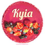Beautifully decorated red velvet berry birthday cake with vibrant fruits and a glowing 'Kyia' name, adding a touch of sweetness and sparkle.