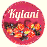Beautifully decorated red velvet berry birthday cake with vibrant fruits and a glowing 'Kylani' name, adding a touch of sweetness and sparkle.